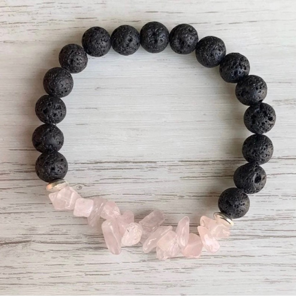 8mm black lava rock with rose quartz chips and silver spacer beads. Strung on